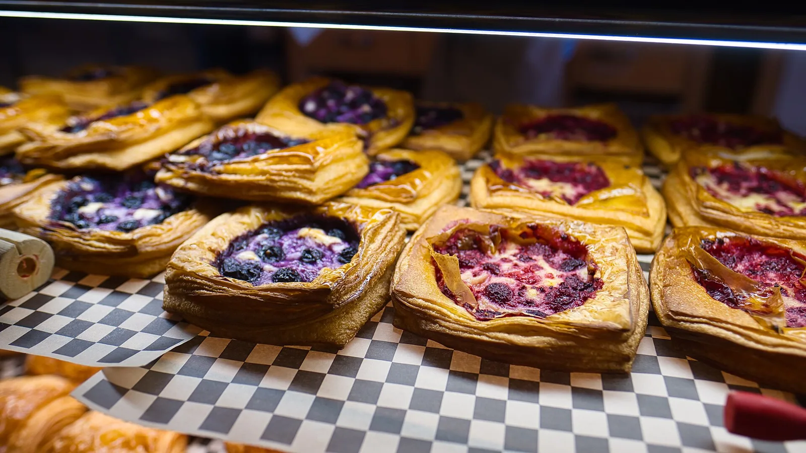 Pastries on display in a bakery case. The photo was not taken in Gainesville.