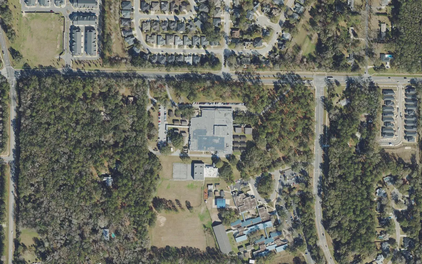 Fort Clarke Middle School on NW 23rd Avenue, west of Gainesville, with Hidden Oak Elementary's buildings to the south, seen from the air